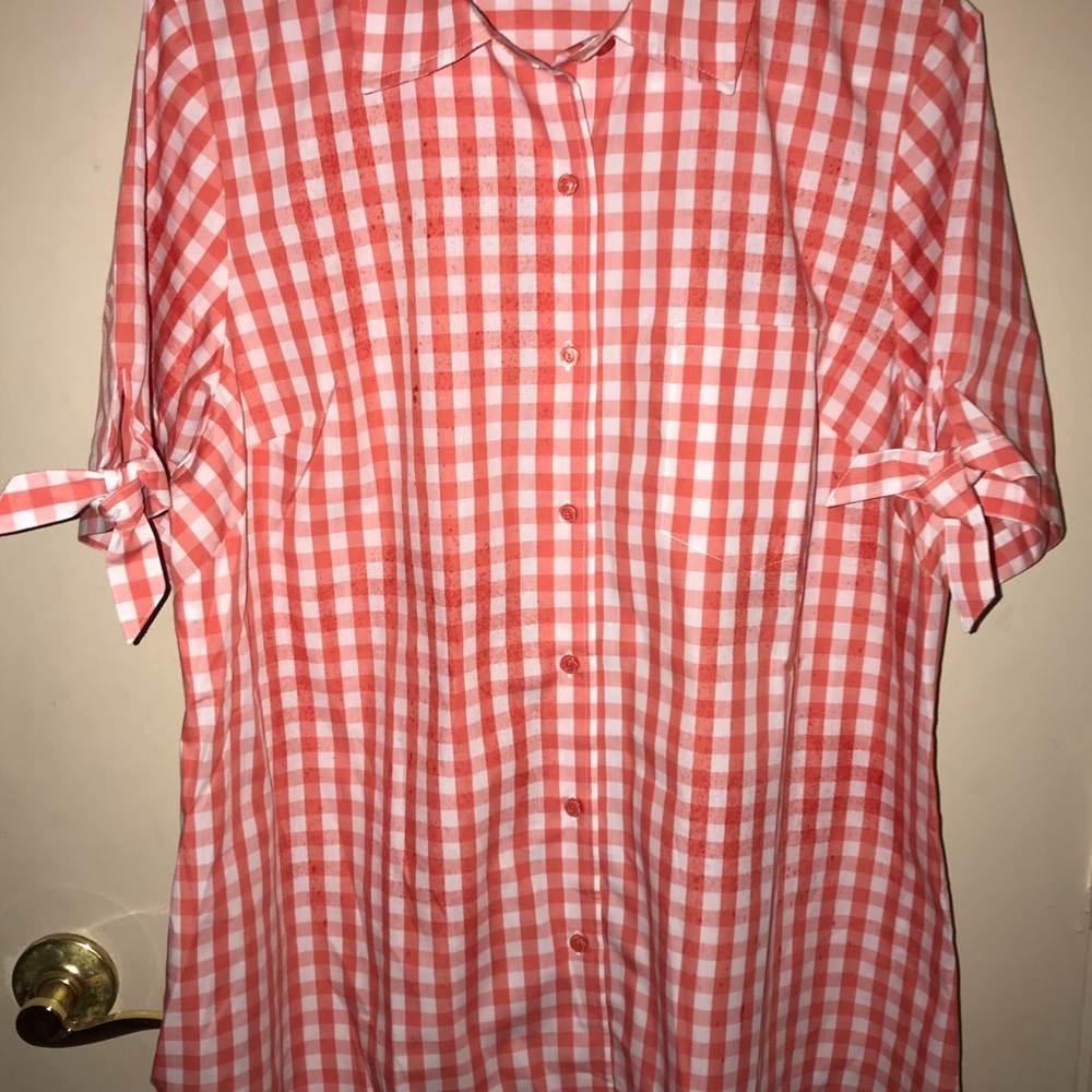 Woman’s orange and white checkered  blouse